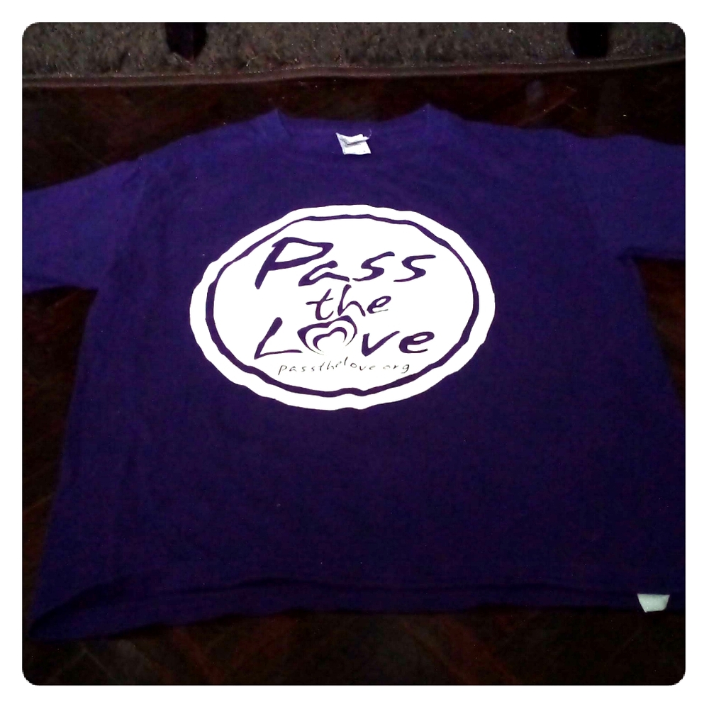 I am selling a purple shirt that says Pass the Lov